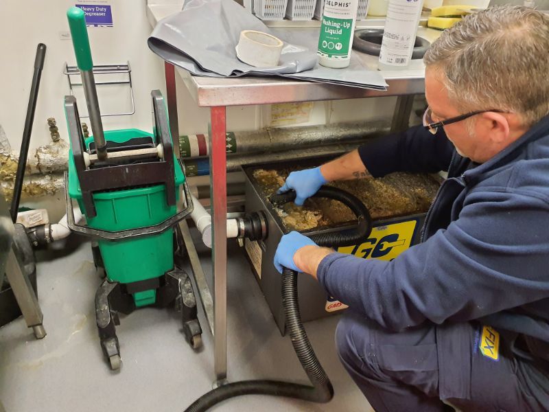 Go-Fix engineer carrying out professional fat, oil, and grease (FOG) management services in London.