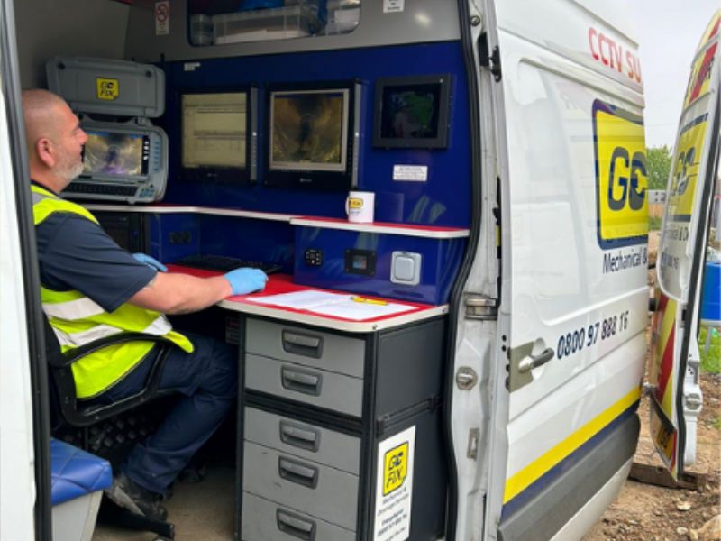 Go-Fix engineer reviewing live CCTV drain footage inside a fully equipped van.
