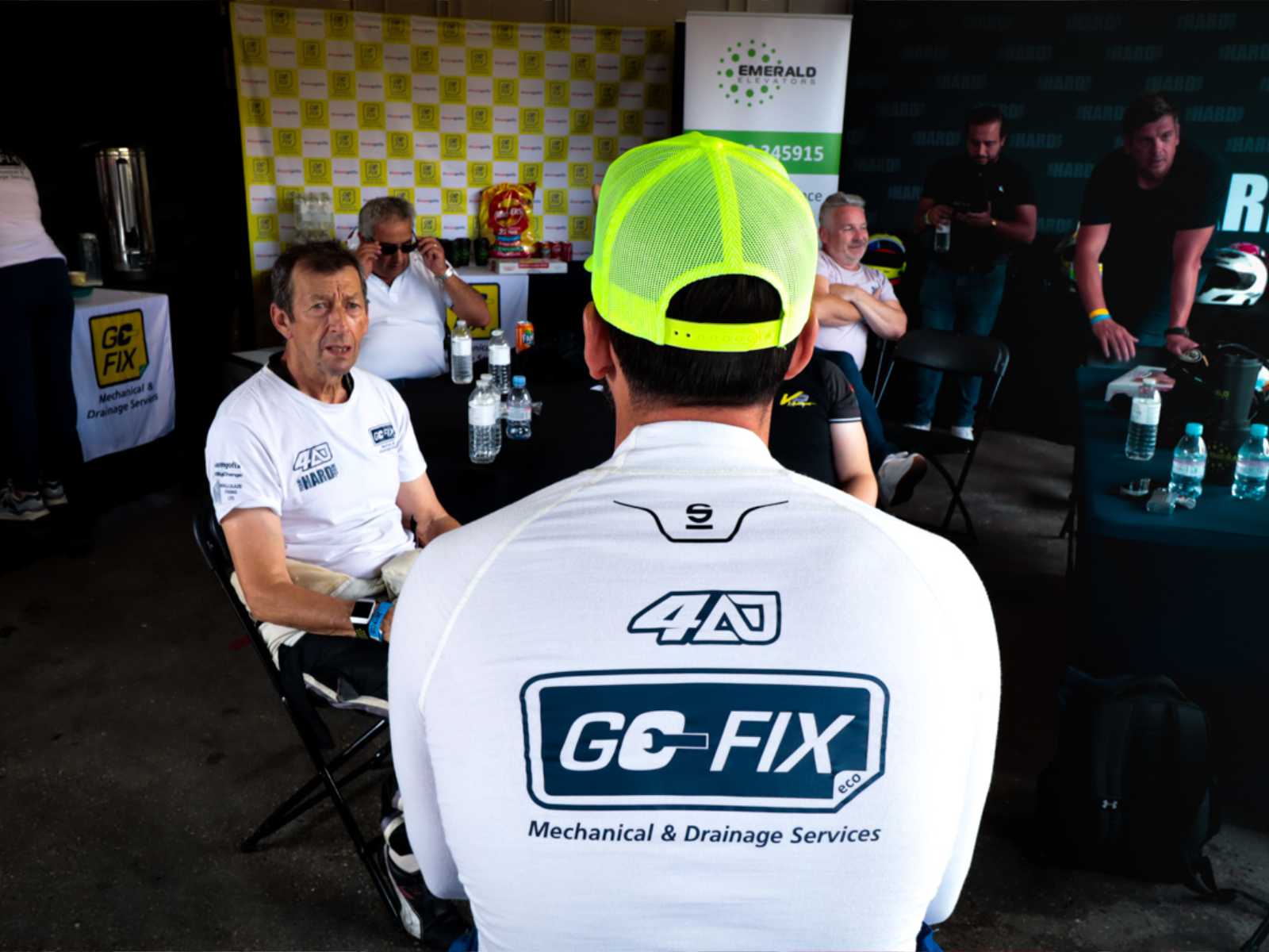 Go-Fix sponsored motor racing car speeding on the track.