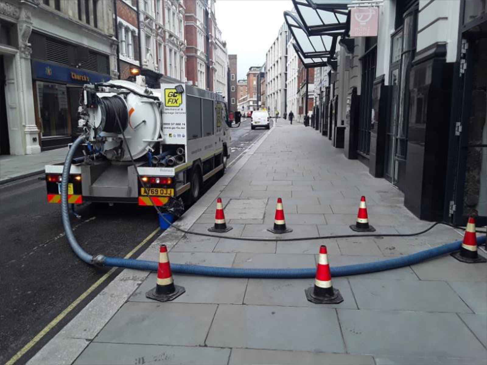 Go-Fix vacuum tanker extracting industrial liquid waste.