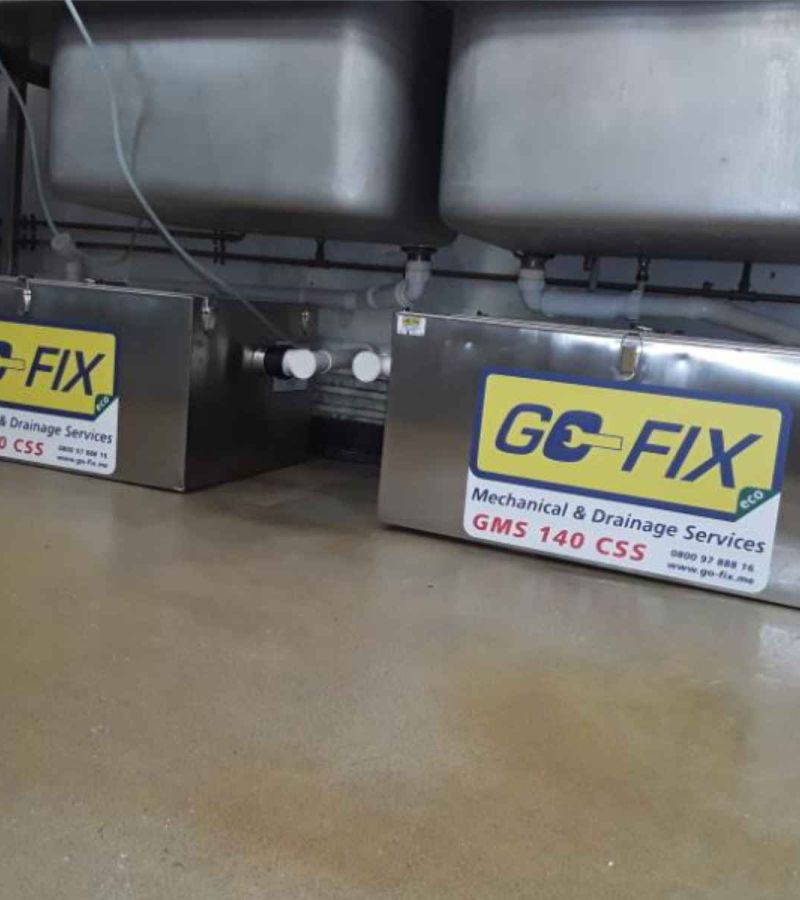 Go-Fix engineer installing a high-efficiency boiler for professional plumbing services.