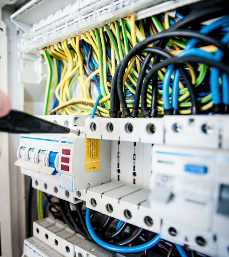 Go-Fix engineer working on a fuse board during multi-trades services in London.