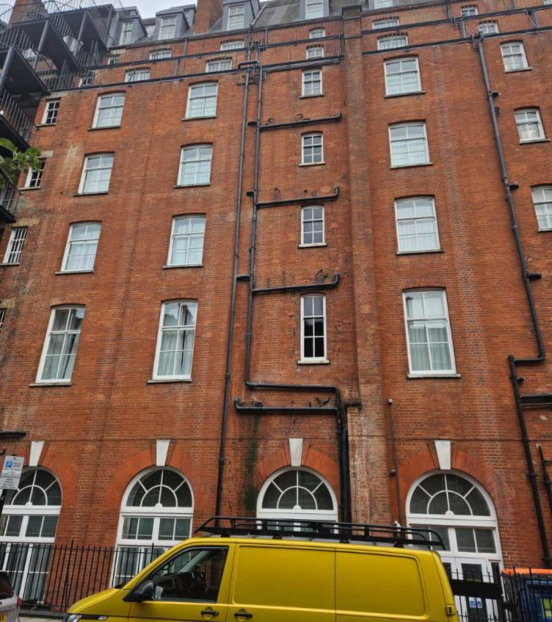 Tall commercial building prepared for expert rope access maintenance by Go-Fix engineers.
